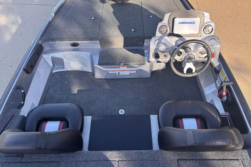 Slide: The Image of Interior of a 2027 Nitro Z17 boat featuring steering wheel and dual seats. - 6