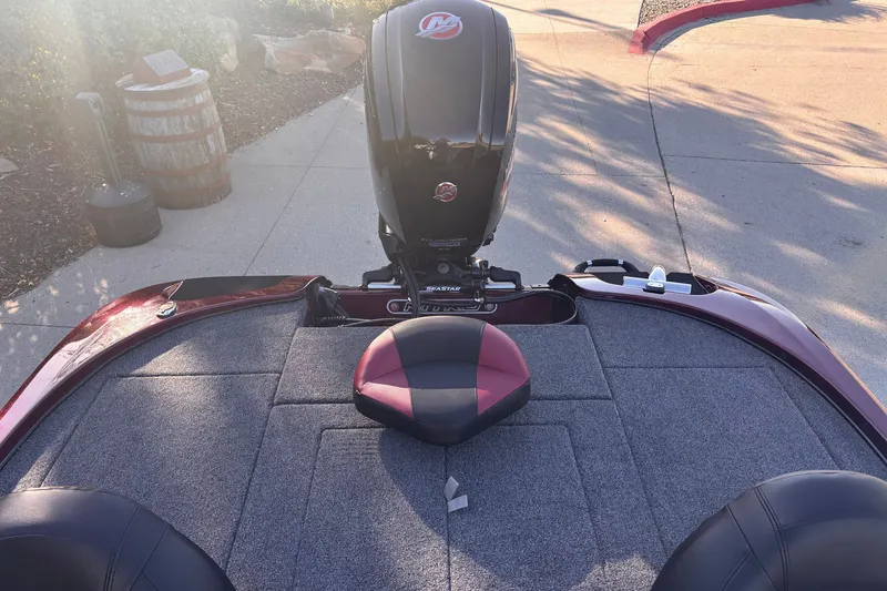 Slide: The Image of Nitro Z17 2027 boat deck with motor, featuring cushioned seating and carpeted surface. - 7