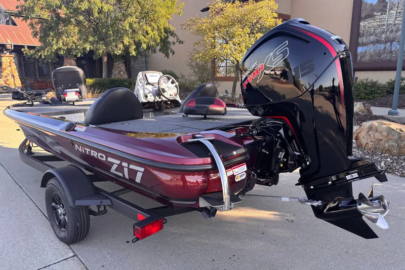 Slide: The Image of 2027 Nitro Z17 boat with powerful Mercury Pro XS engine, parked outdoors. - 2