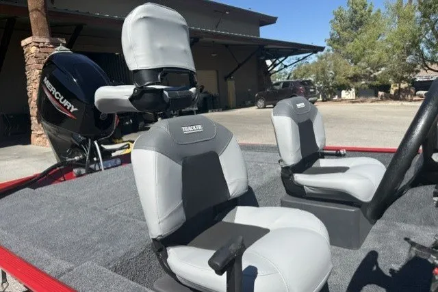 Slide: The Image of 2027 Tracker Bass Tracker Classic XL boat interior with gray seats and Mercury engine. - 68