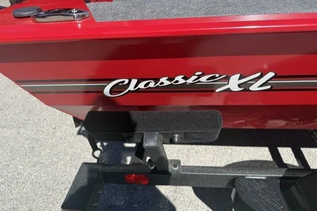 Slide: The Image of Red 2027 Tracker Bass Tracker Classic XL boat with "Classic XL" logo. - 64