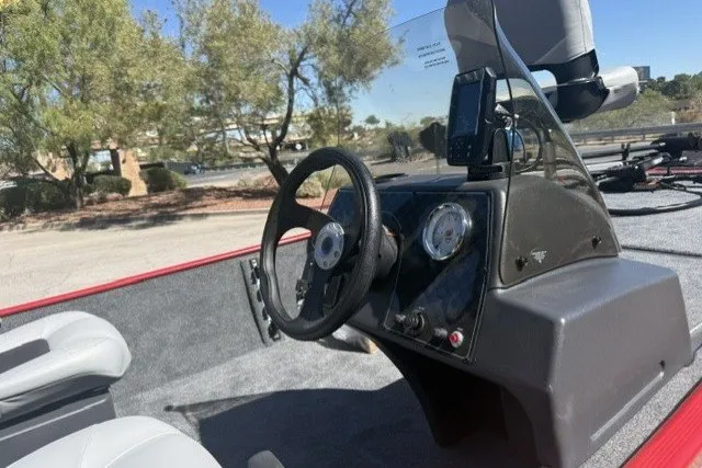 Slide: The Image of 2027 Tracker Bass Tracker Classic XL boat interior with steering wheel and dashboard. - 67