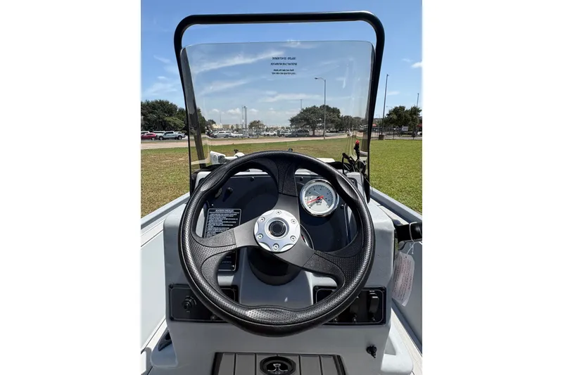 Slide: The Image of Steering console of 2027 Tracker Bass Tracker Classic CC boat, featuring a clear windshield. - 67