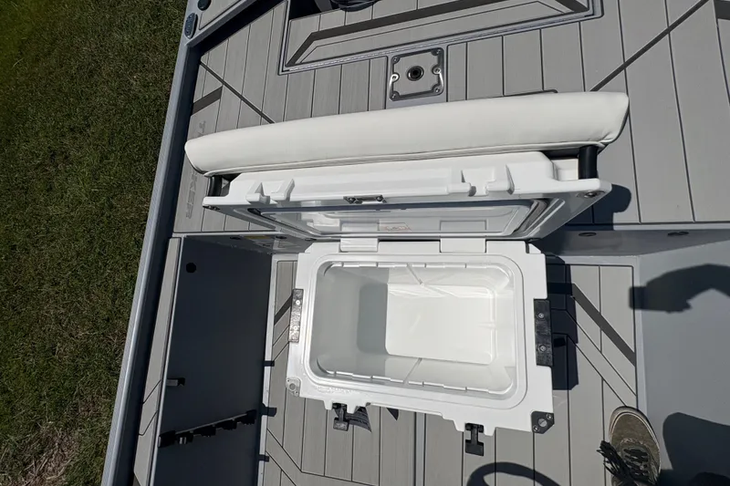 Slide: The Image of Open storage compartment on 2027 Tracker Bass Tracker Classic CC boat deck. - 17