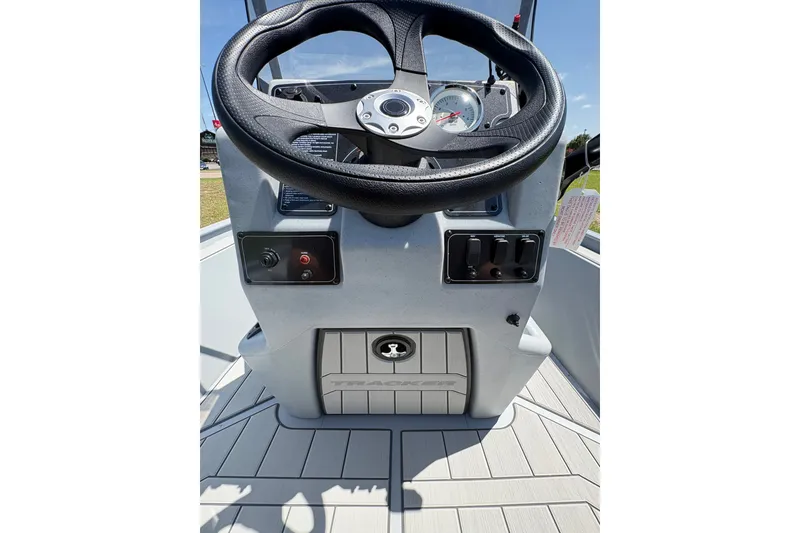 Slide: The Image of Steering console of 2027 Tracker Bass Tracker Classic CC boat, featuring controls and gauges. - 68