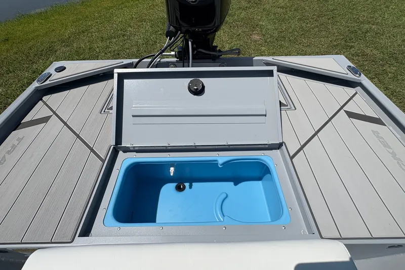 Slide: The Image of 2027 Tracker Bass Tracker Classic CC boat with open storage compartment. - 19