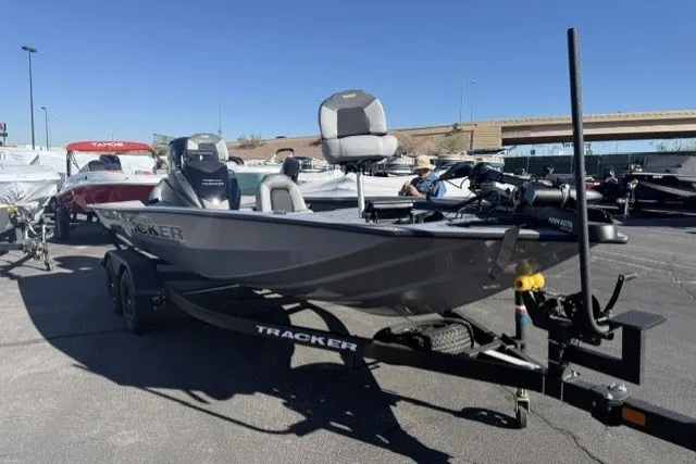 The Image of 2027 Tracker Pro Team 195 boat on trailer in outdoor lot. - 0