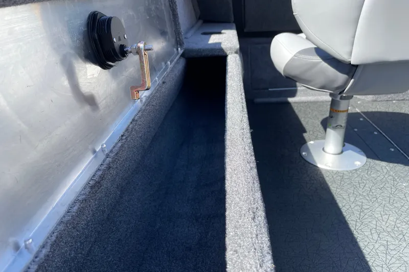 Slide: The Image of Interior of 2027 Tracker Pro Guide V-175 WT boat with seating and storage. - 13