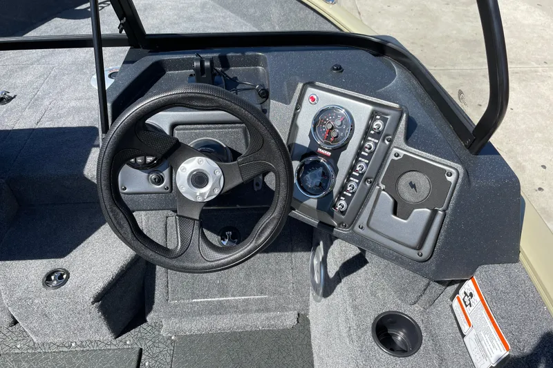 Slide: The Image of Steering console of 2027 Tracker Pro Guide V-175 WT boat with gauges and controls. - 16