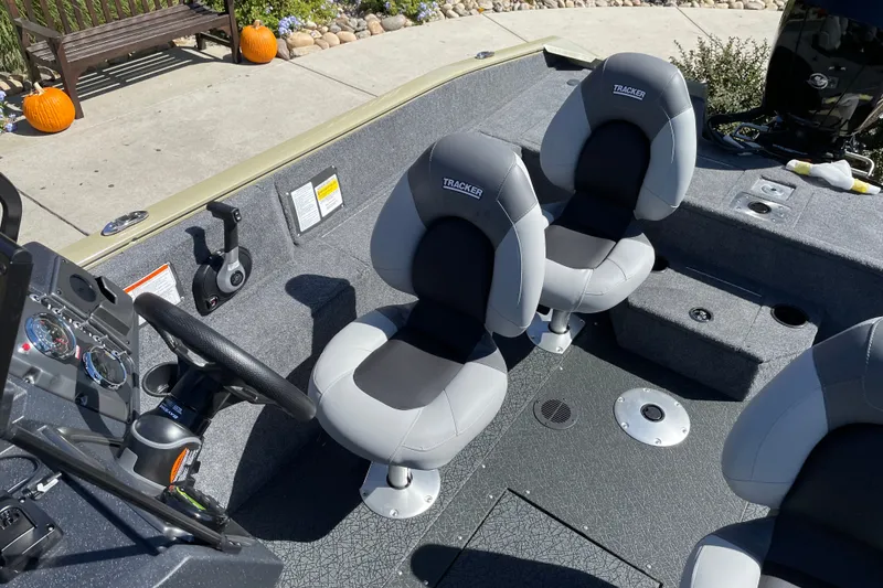 Slide: The Image of 2027 Tracker Pro Guide V-175 WT boat interior with dual seats and steering console. - 27
