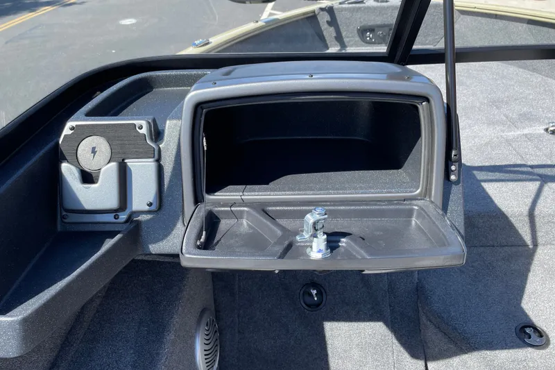 Slide: The Image of 2027 Tracker Pro Guide V-175 WT boat dashboard with open storage compartment. - 15
