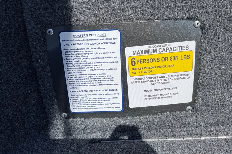 Slide: The Image of Tracker Pro Guide V-175 WT 2027 boat capacity plate, detailing safety checklist and maximum load limits. - 30