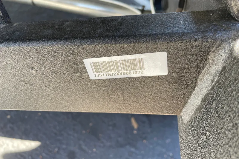 Slide: The Image of Barcode sticker on a 2027 Tracker Pro Guide V-175 WT boat component. - 67