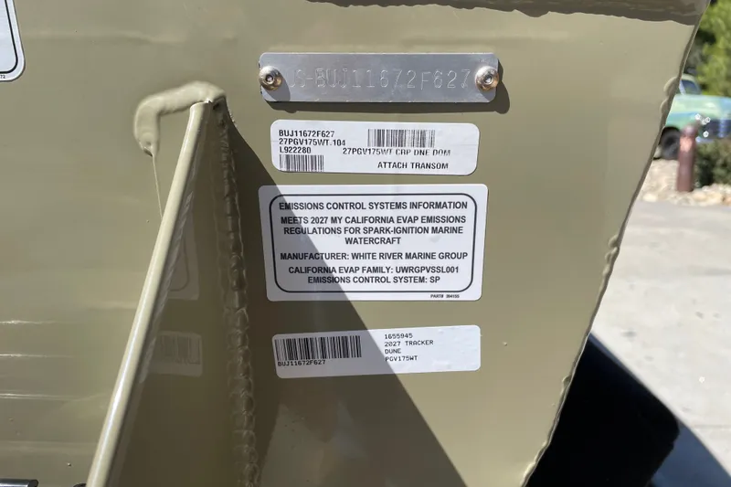Slide: The Image of 2027 Tracker Pro Guide V-175 WT emissions control information label on boat transom. - 65