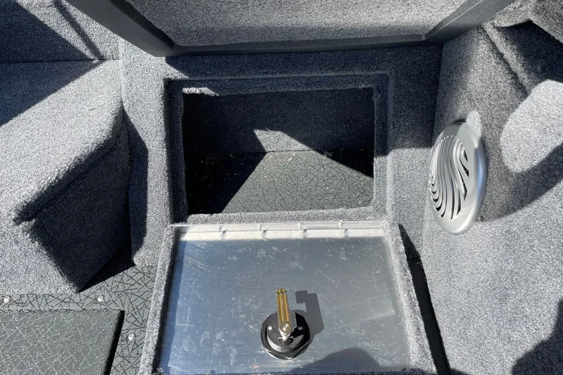 Slide: The Image of Interior of 2027 Tracker Pro Guide V-175 WT boat showing storage compartment and speaker. - 17