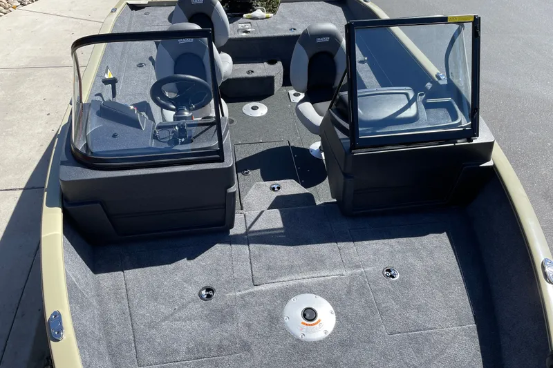 Slide: The Image of 2027 Tracker Pro Guide V-175 WT boat interior with dual consoles and seating. - 24
