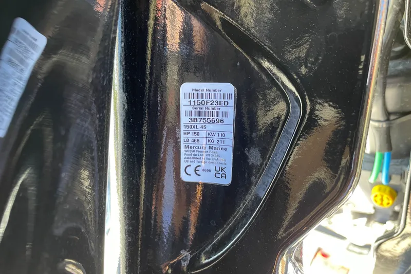 Slide: The Image of Label on a 2027 Tracker Pro Guide V-175 WT boat engine, showing model and serial numbers. - 66