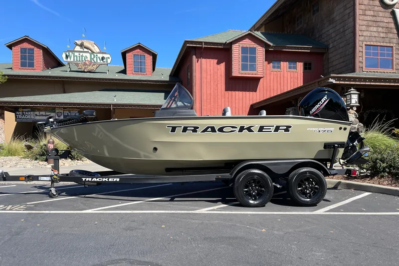 The Image of 2027 Tracker Pro Guide V-175 WT boat on trailer outside White River Fly Shop. - 0