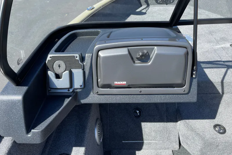 Slide: The Image of 2027 Tracker Pro Guide V-175 WT boat dashboard with storage compartment and charging port. - 14