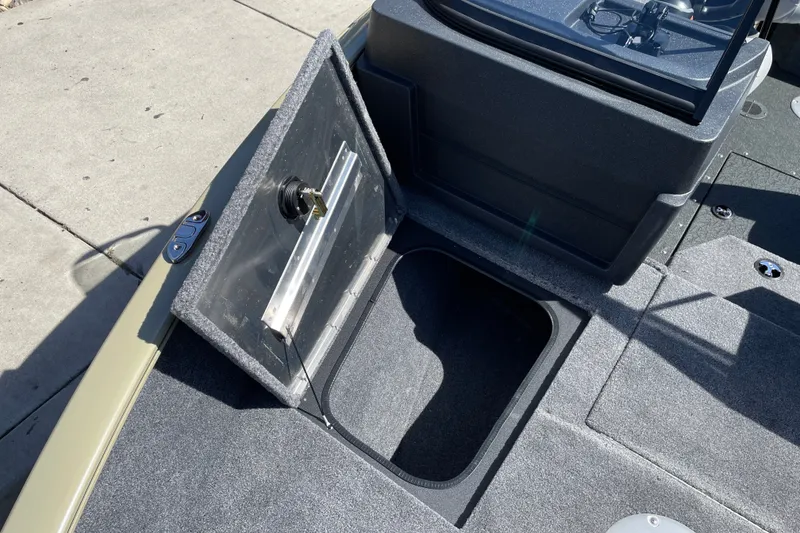 Slide: The Image of Open storage compartment on 2027 Tracker Pro Guide V-175 WT boat deck. - 22