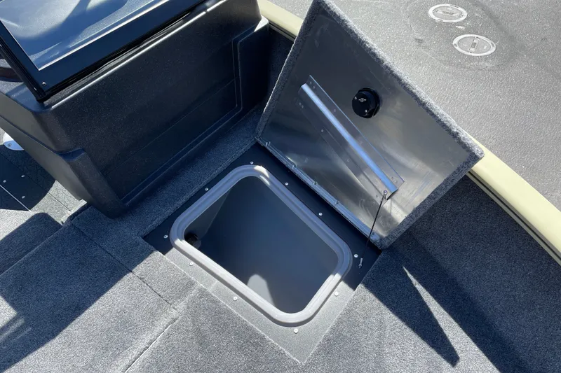 Slide: The Image of Open storage compartment on 2027 Tracker Pro Guide V-175 WT boat deck. - 23