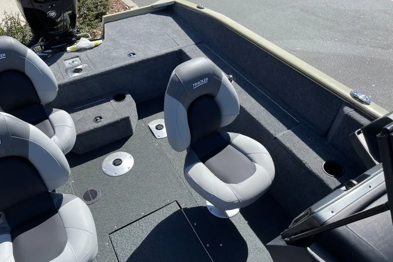 Slide: The Image of Interior of 2027 Tracker Pro Guide V-175 WT boat with gray seating and carpeted flooring. - 28