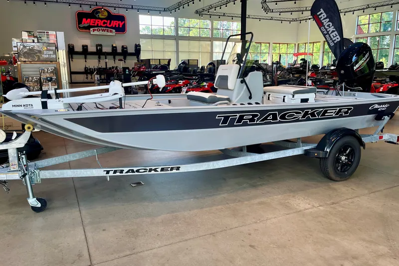 The Image of 2027 Tracker Bass Tracker Classic CC boat displayed in showroom with Mercury engine. - 0
