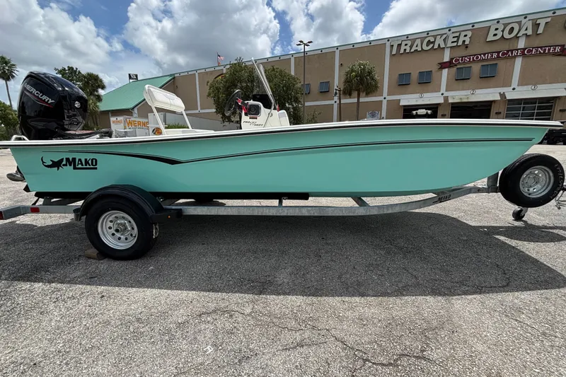 Slide: The Image of 2027 Mako Pro Skiff 17 CC boat on trailer outside Tracker Boat Center. - 4