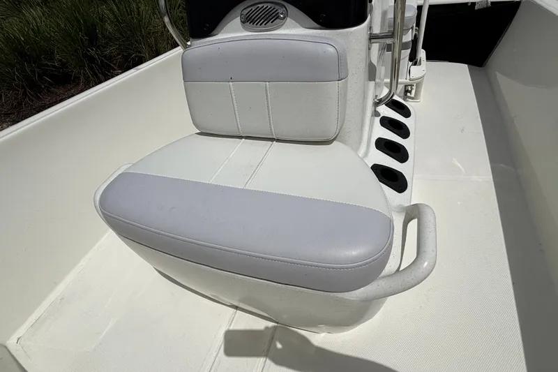 Slide: The Image of 2027 Mako Pro Skiff 17 CC boat seat with rod holders and console. - 13