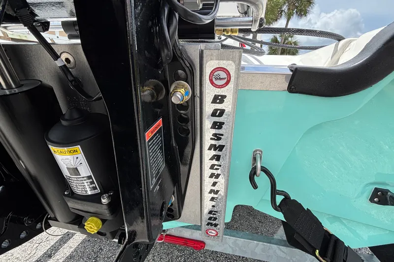 Slide: The Image of Close-up of 2027 Mako Pro Skiff 17 CC boat engine mount and hydraulic system. - 8