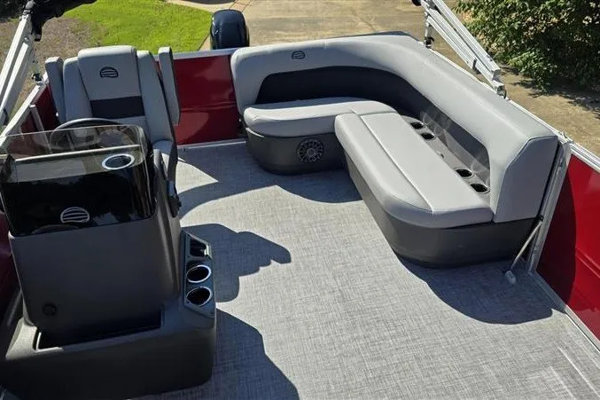 Slide: The Image of 2027 Sun Tracker Party Barge 16 DLX interior with gray seating and modern console. - 14