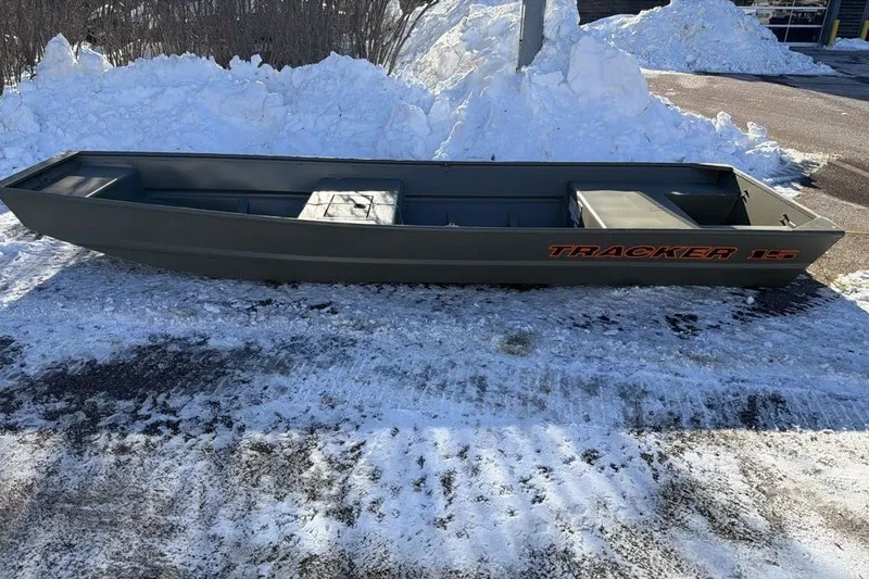 The Image of 2027 Tracker Grizzly 15 Jon boat on snowy ground, side view. - 0