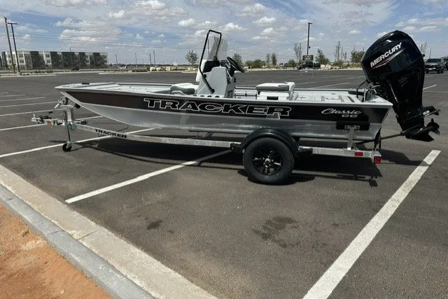 The Image of 2027 Tracker Bass Tracker Classic CC boat on trailer in parking lot. - 0