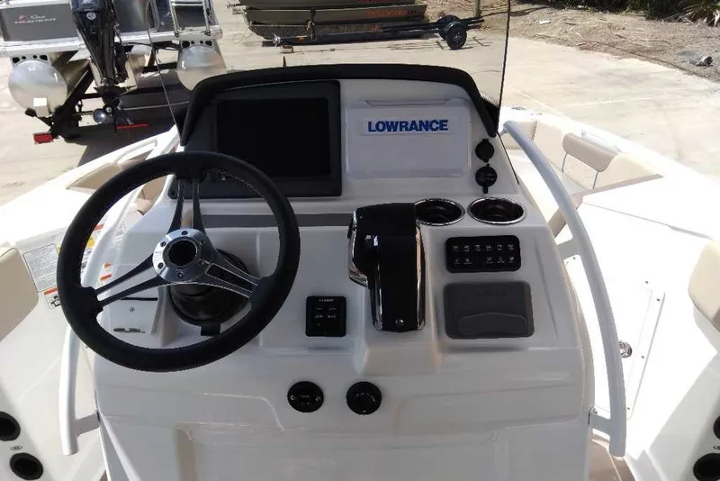 Slide: The Image of Steering console of 2027 Tahoe 2150 CC boat with Lowrance electronics. - 4