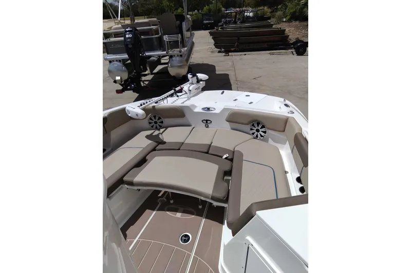 Slide: The Image of 2027 Tahoe 2150 CC boat interior with beige seating and modern design. - 8