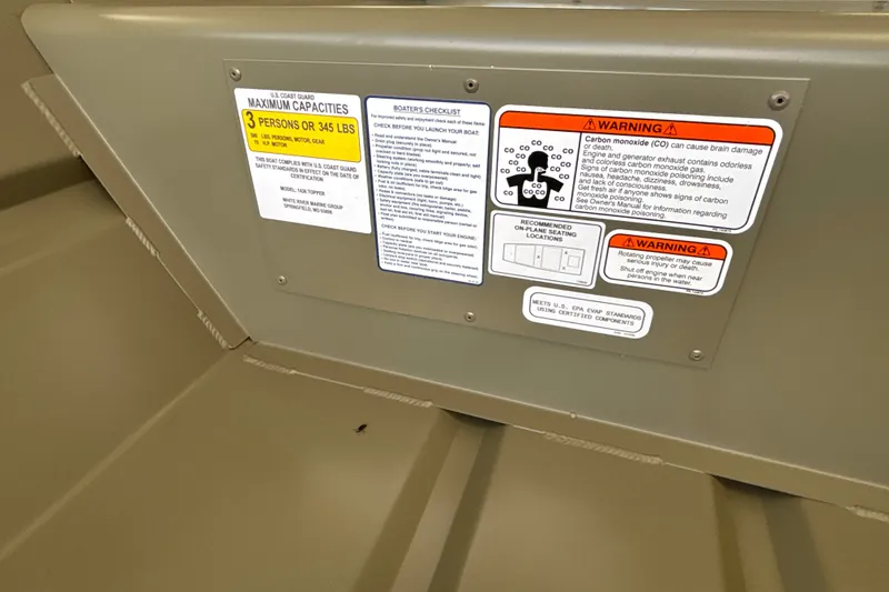Slide: The Image of 2027 Tracker Grizzly 14 Jon boat safety and capacity warning labels. - 18