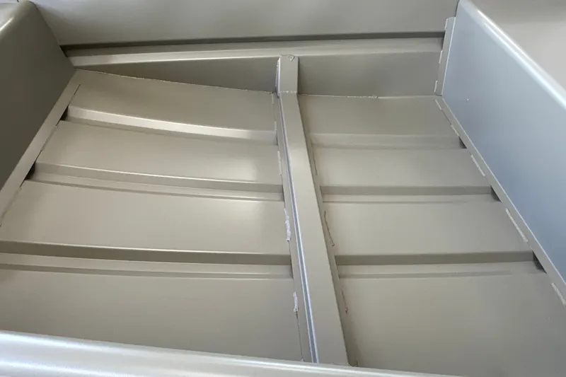Slide: The Image of Interior view of 2027 Tracker Grizzly 14 Jon boat, showcasing aluminum construction. - 14