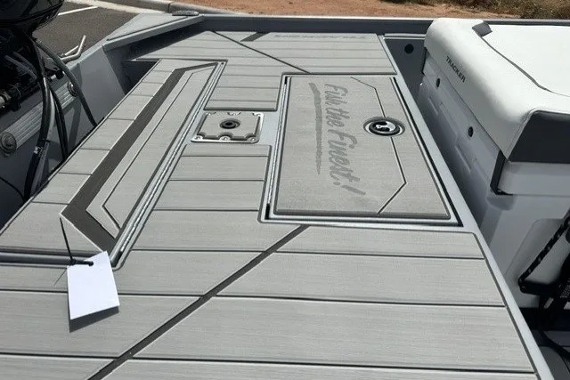 Slide: The Image of 2027 Tracker Bass Tracker Classic CC boat deck with sleek design and storage compartments. - 16