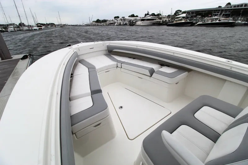 Slide: The Image of 2020 Regulator 28 Forward Seating boat with spacious, cushioned seating area. - 10