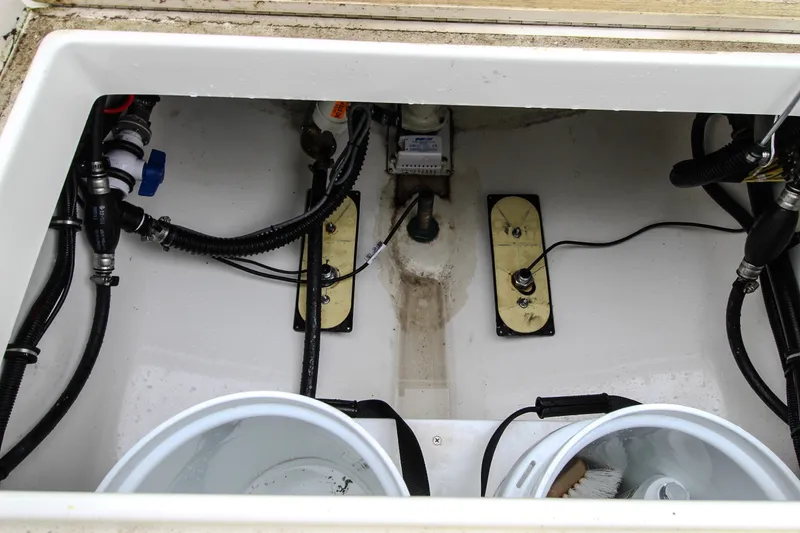 Slide: The Image of 2020 Regulator 28 Forward Seating boat interior wiring and plumbing components. - 14
