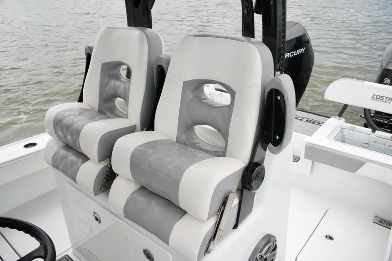 Slide: The Image of 2023 Costa Custom Boats 264 HC interior seating with luxurious gray and white upholstery. - 40