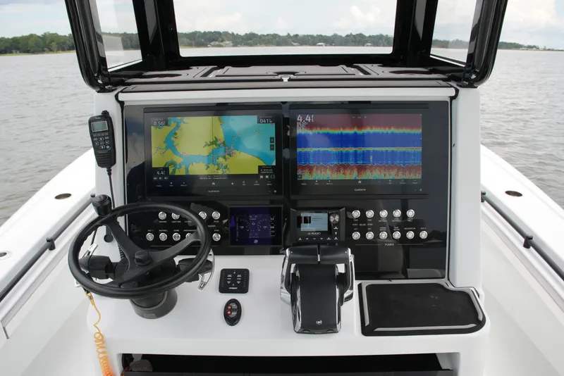 Slide: The Image of 2023 Costa Custom Boats 264 HC helm with advanced navigation and control systems. - 45