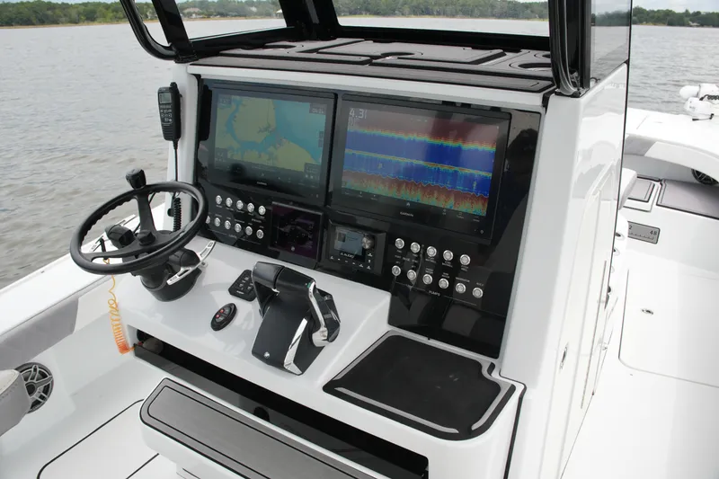 Slide: The Image of Control panel of 2023 Costa Custom Boats 264 HC with advanced navigation displays. - 43