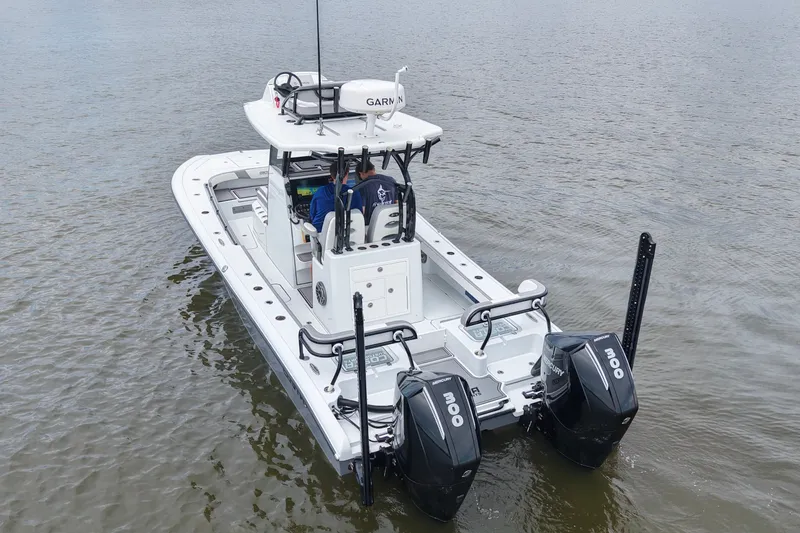 Slide: The Image of 2023 Costa Custom Boats 264 HC on water, featuring dual Mercury engines. - 24