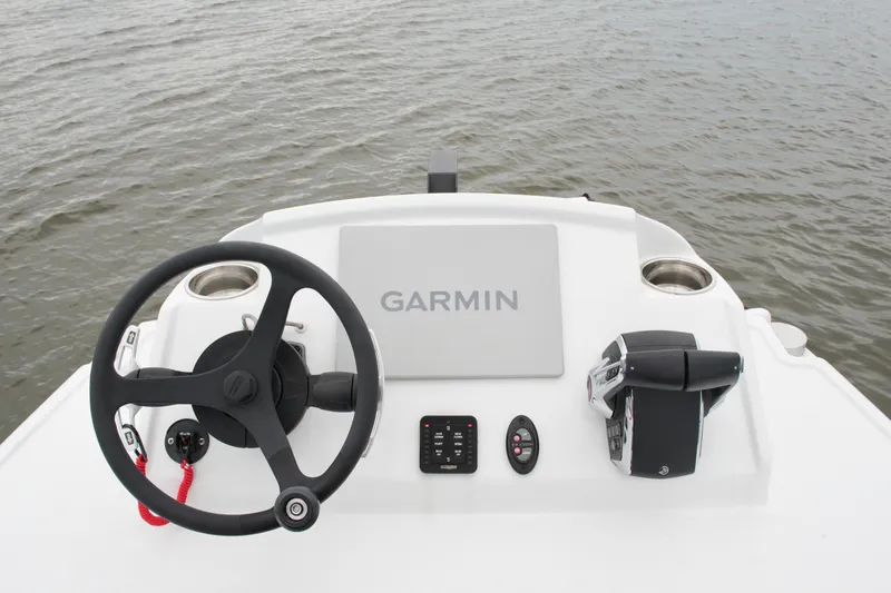 Slide: The Image of Steering console of 2023 Costa Custom Boats 264 HC with Garmin navigation system. - 65