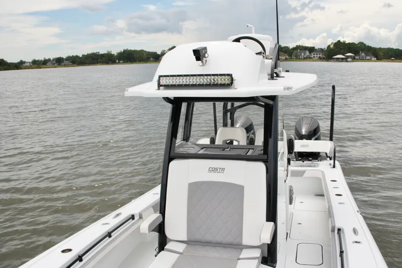 Slide: The Image of 2023 Costa Custom Boats 264 HC on water, featuring sleek design and modern amenities. - 38