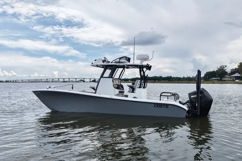 Slide: The Image of 2023 Costa Custom Boats 264 HC on calm water, showcasing sleek design and powerful engine. - 15
