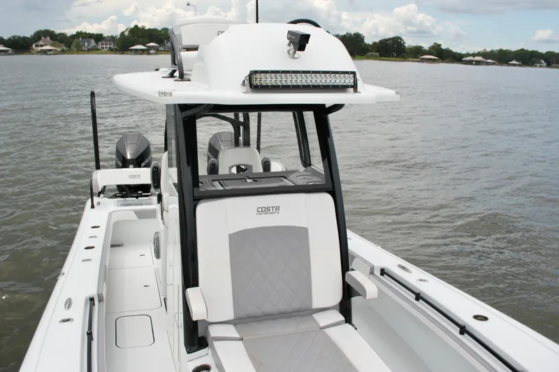 Slide: The Image of 2023 Costa Custom Boats 264 HC on water, showcasing sleek design and modern features. - 33