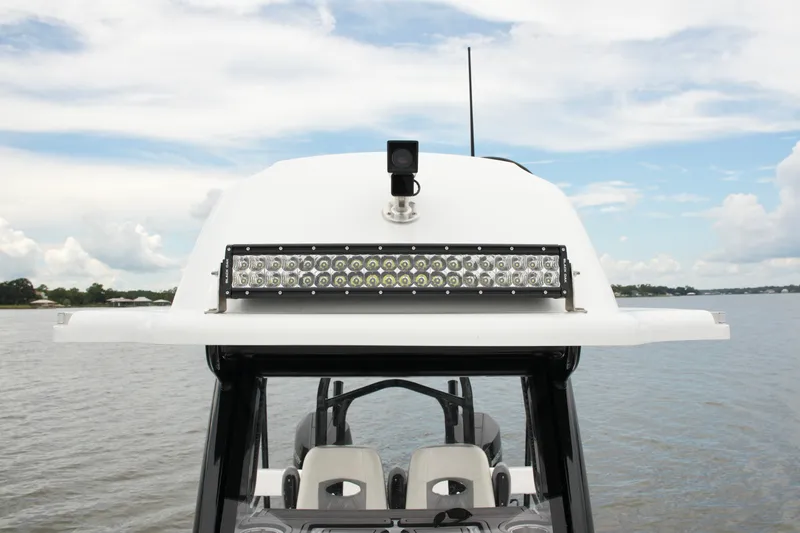 Slide: The Image of 2023 Costa Custom Boats 264 HC with LED light bar on calm water. - 36