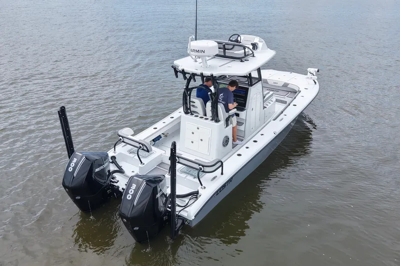 Slide: The Image of 2023 Costa Custom Boats 264 HC on water, featuring dual Mercury engines. - 26